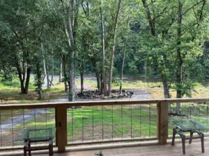 Black Fork River Cabin view of back yard and river from back porch.