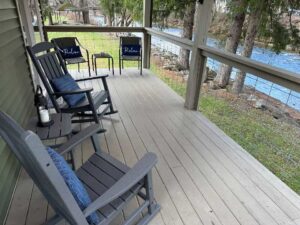 Parsons Riverside Retreat back porch with chairs and tables overlooking the Shavers Form of the Cheat River.